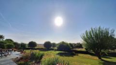 Source-feed image associated with Heat health alerts in England as temperatures set to reach 34C