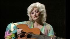 Source-feed image associated with How Dolly Parton told her life story through six iconic songs
