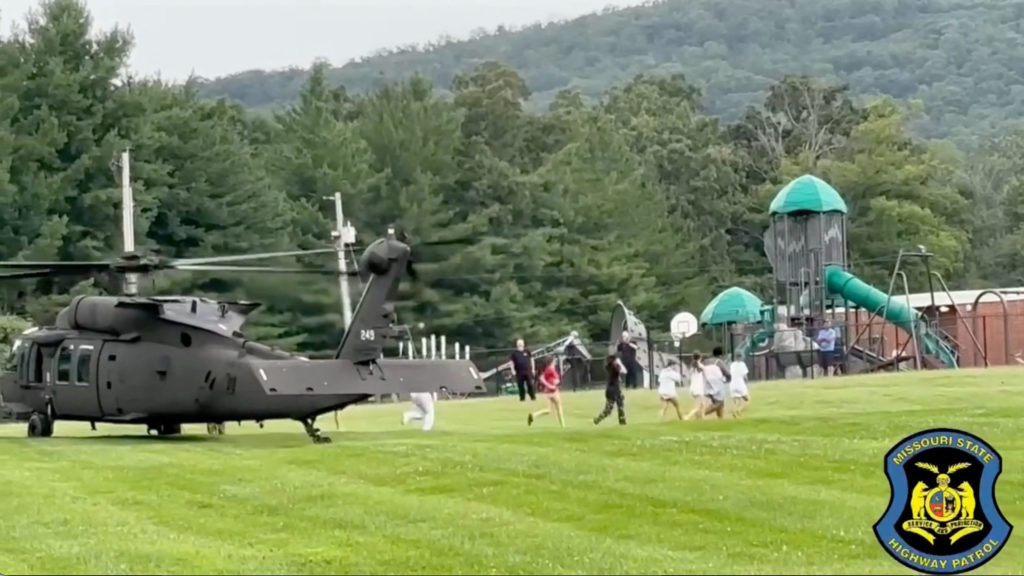 Source-feed image associated with Missouri flooding leaves one dead, while rescuers helicopter more than 200 to safety at summer camp