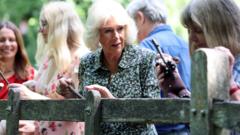 Source-feed image associated with Queen marks Pooh centenary by playing poohsticks