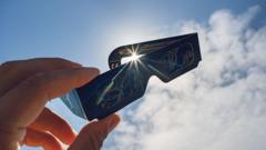 Source-feed image associated with Eclipse chasers scramble for glasses as stocks run low