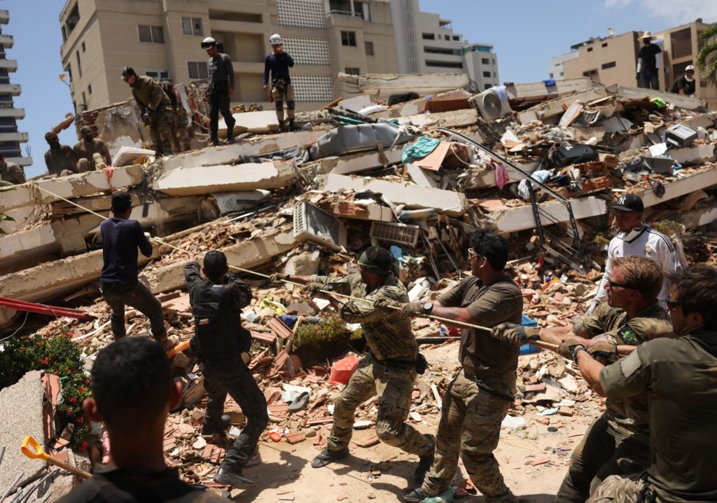 Source-feed image associated with 'We're not stopping': Virginia rescue team searches for quake survivors in Venezuela