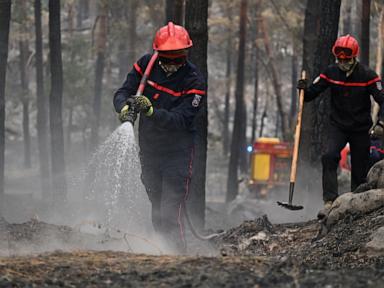 Source-feed image associated with 1000 evacuated from fire near Paris; Spanish authorities identify fire victims