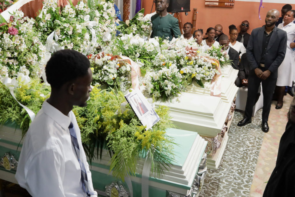 Source-feed image associated with Hundreds attend funeral in Haiti for 4 victims of brutal gang attack that killed 47