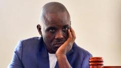 Source-feed image associated with Lawyer in high-profile Ugandan treason case charged with related offence