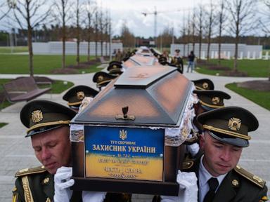 Source-feed image associated with Ukraine buries its unknown soldiers as families wait for identification