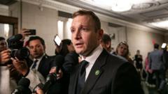Source-feed image associated with US congressman refuses to drop re-election bid over ex-wife's abuse claims