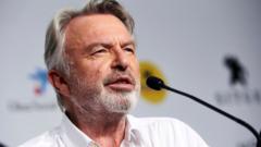 Source-feed image associated with Actor Sam Neill died from pneumonia, agent confirms