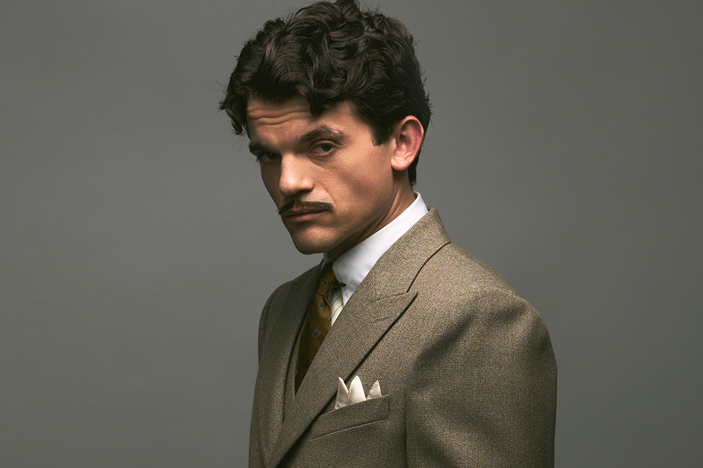 Source-feed image associated with Edward Bluemel Suits Up as Detective Poirot in First Look at BBC and BritBox Series ‘Hercule’