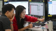 Source-feed image associated with Asia stock markets slide as tech shares slump