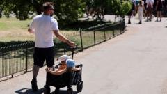 Source-feed image associated with UK bakes in 35C highs as millions under hosepipe bans