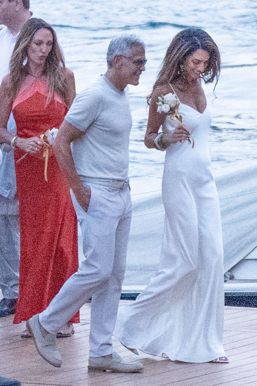 Source-feed image associated with Amal and George Clooney See Out Euro Summer in Matching Bright Whites
