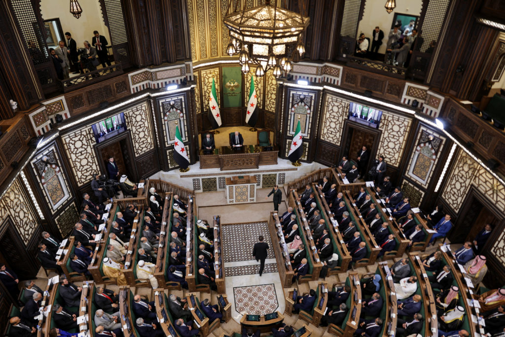 Source-feed image associated with Syria's new parliament holds first session since ouster of ex-President Assad