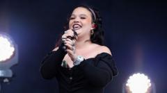 Source-feed image associated with Lola Young surprises Reading Festival with final day set