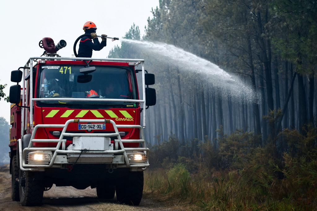 Source-feed image associated with News Wrap: French firefighters battle massive wildfire