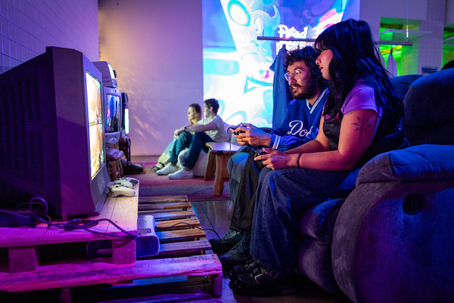Image from linked report: A rainbow of iMac G3s? This 'old tech' party in L.A. is a balm for our isolated times