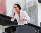 Source-feed image associated with ‘He lived here a long time, so it feels poignant’: Nick Cave thrills Brighton passersby with secret rooftop gig