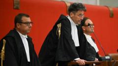Source-feed image associated with Italian officials handed jail terms for Genoa bridge disaster that killed 43