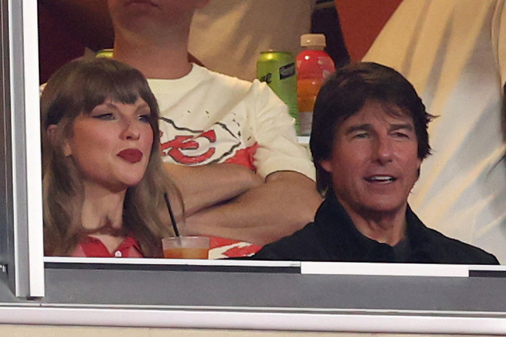 Source-feed image associated with Tom Cruise Says Taylor Swift Was ‘Schooling Me on Football’ at Chiefs Game, Calls Her a ‘Brilliant Musician and Director’