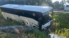 Source-feed image associated with Bus crashes into six cars in Virginia, killing 5 and injuring dozens