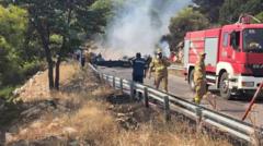 Source-feed image associated with Two crew killed after firefighting helicopters collide in Greece, as British pilot survives