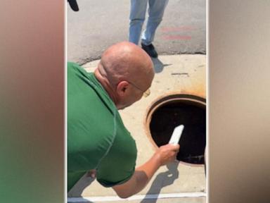 Source-feed image associated with WATCH: Dad's sewer rescue mission for daughter's phone goes viral
