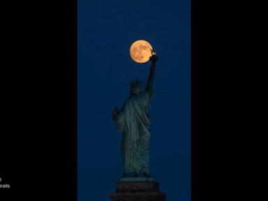 Source-feed image associated with WATCH: Strawberry moon glows over Statue of Liberty ahead of America's 250th