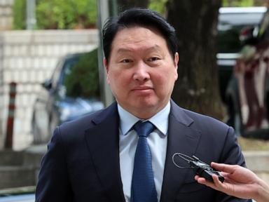 Source-feed image associated with Chairman of South Korean tech giant SK ordered to pay $640 million in divorce case
