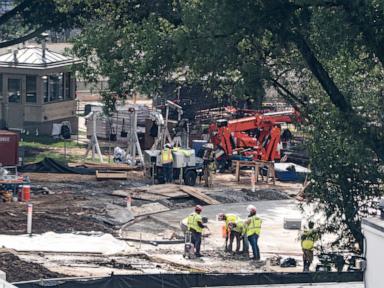 Source-feed image associated with Crews remove granite seal on White House helipad, signaling potential project delays