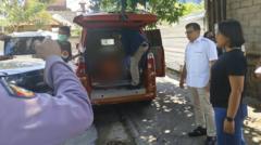 Source-feed image associated with Bali police investigate after Australian man and children found dead in home