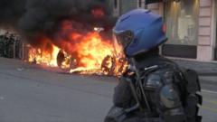 Source-feed image associated with Watch: Protesters clash with police ahead of G7 summit in Geneva