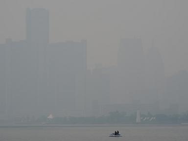 Source-feed image associated with Canadian wildfire smoke turns air hazardous in the US Midwest. Officials say stay inside