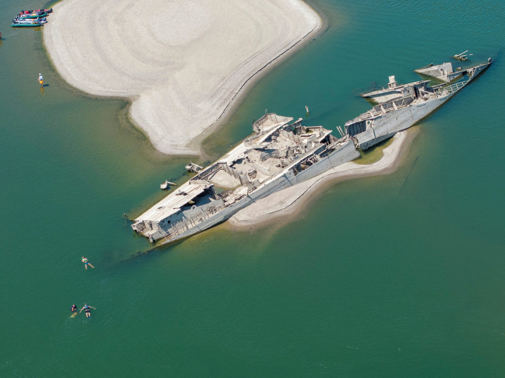 Source-feed image associated with The Danube River's water is dropping so low that World War II ships are emerging