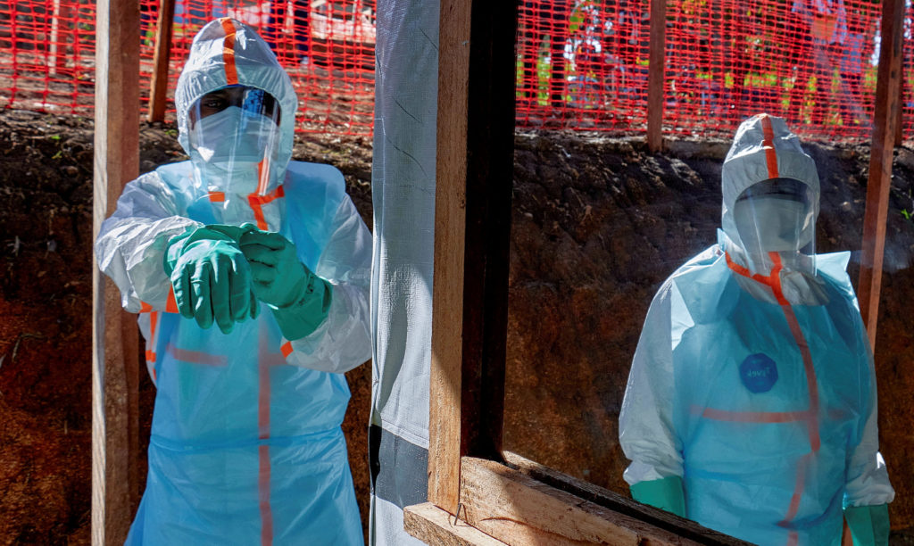 Source-feed image associated with Health workers struggle to contain Ebola outbreak