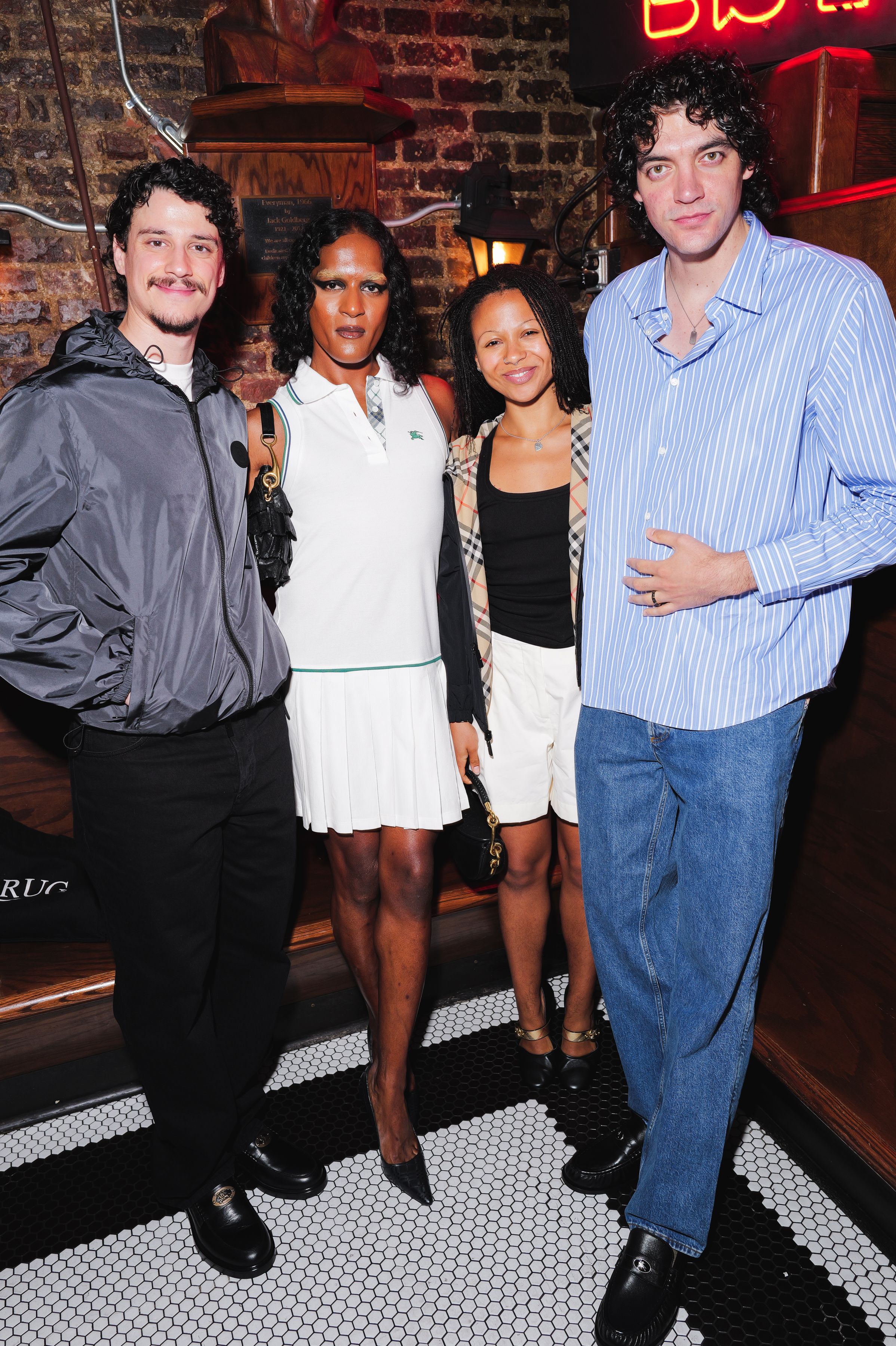 Source-feed image associated with Check, Mate! Burberry Hosted a Posh Pub Watch Party During the World Cup