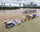 Source-feed image associated with Weather tracker: Typhoon leaves people stranded on rooftops in China