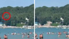 Source-feed image associated with Russia says seven killed and 40 injured by Ukrainian drone hitting busy beach