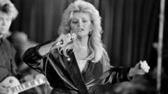 Source-feed image associated with Bonnie Tyler, the gravel-voiced star who sang her way into music history