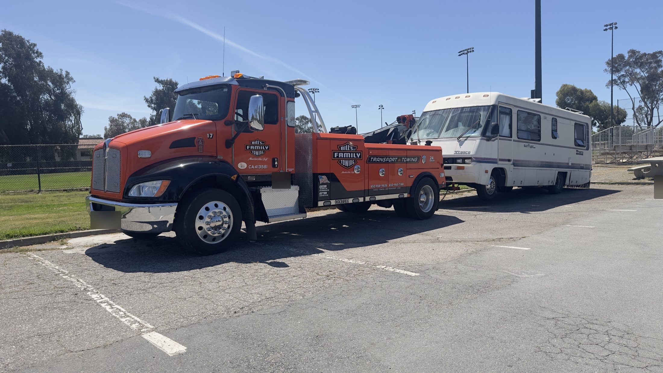 Palo Alto police, a tow truck, and an RV at a parking lot scene on June 1, 2026